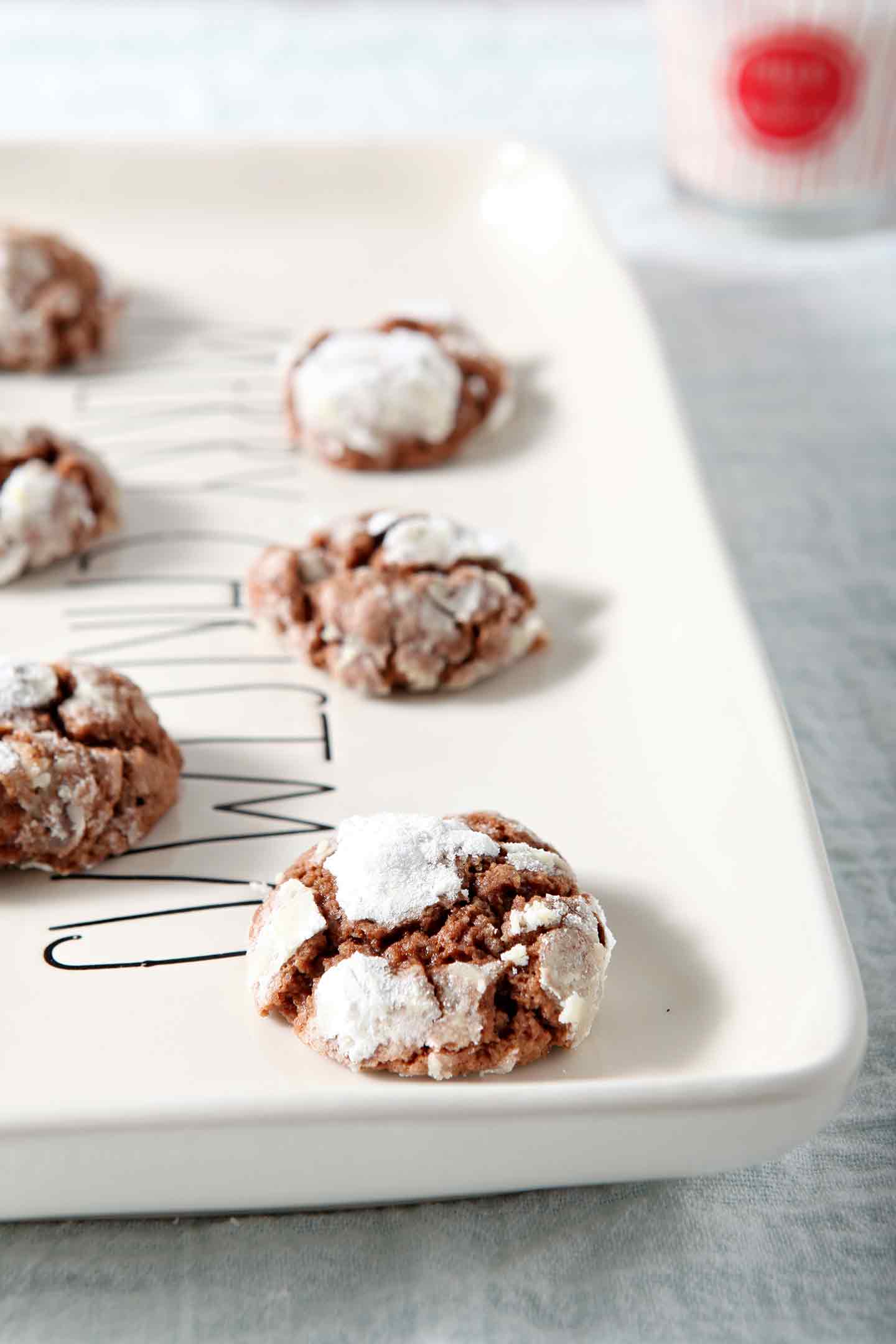 chocolate crinkle cookies on a white serving tray