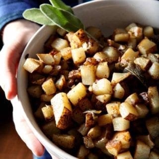 sage browned butter fries in a white bowl