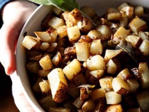 sage browned butter fries in a white bowl