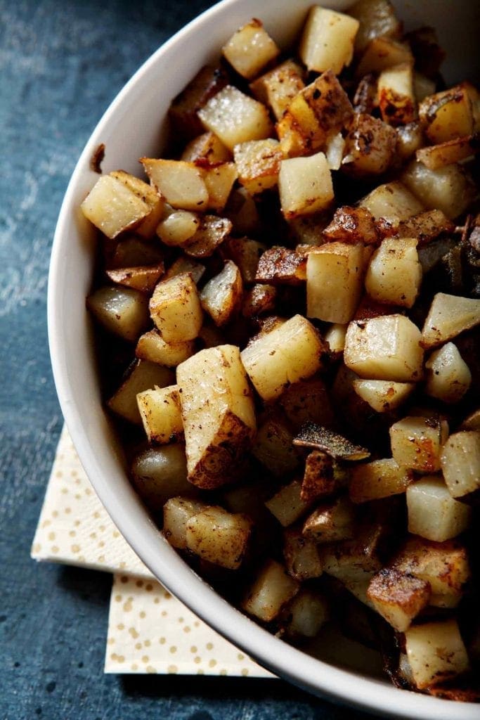 home fries in a white bowl