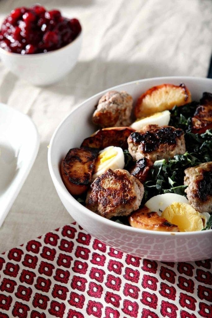 A bowl of Thanksgiving brunch salad on a tabletop