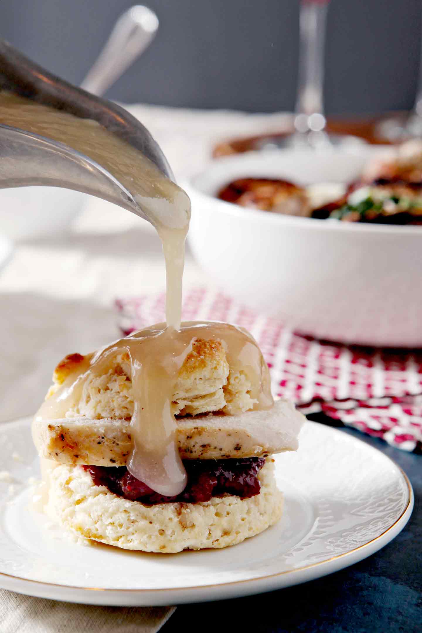 pouring gravy on biscuits