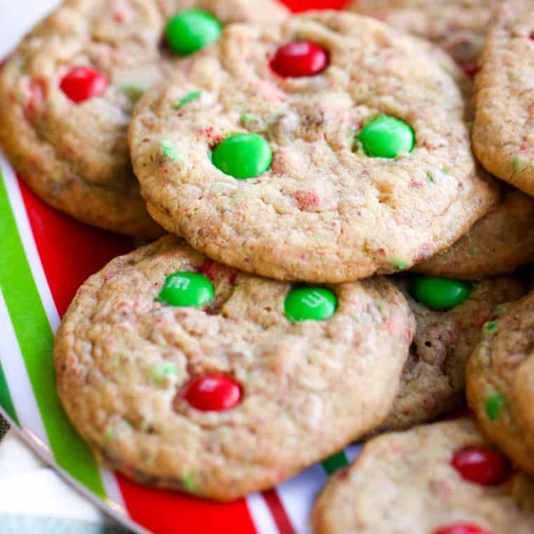Close up of Mom's M&M cookies on a stripped christmas plate