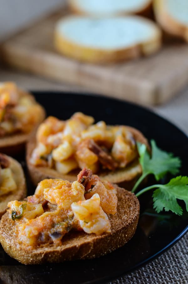 seafood bruschetta on a black plate