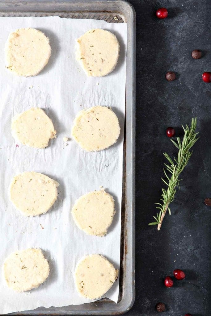 ginger rosemary shortbread cookies on a baking sheet ready to bake