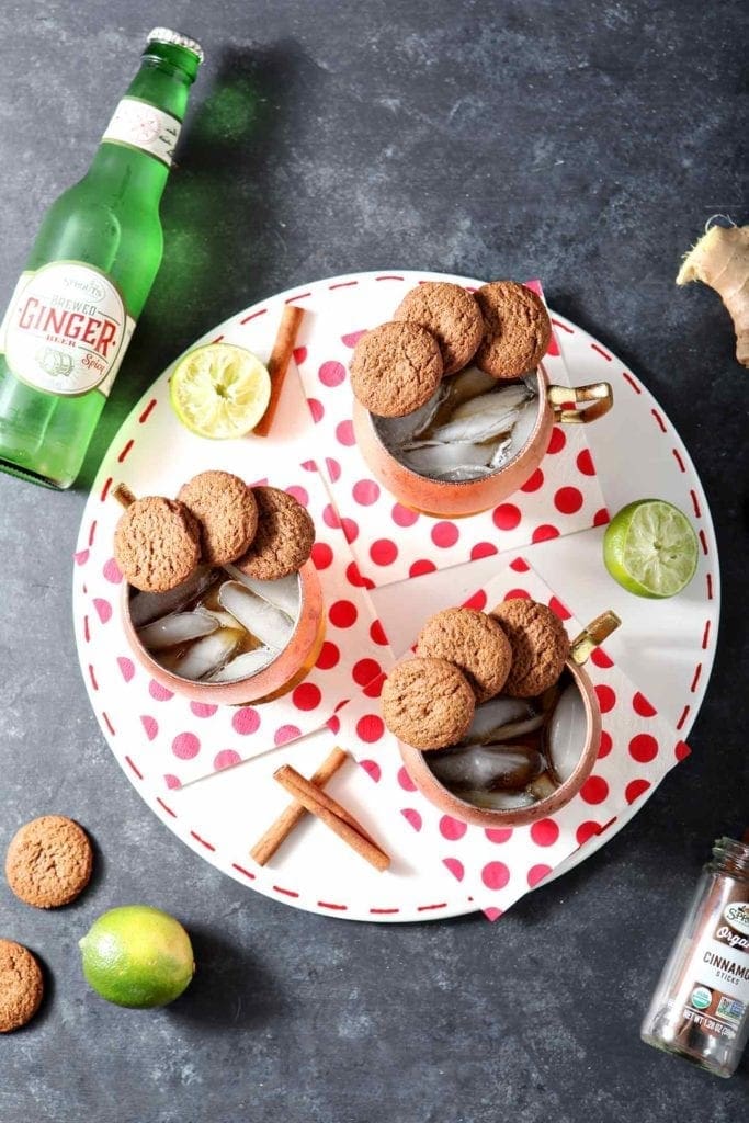 three gingerbread mules on a plate with polka dot napkins