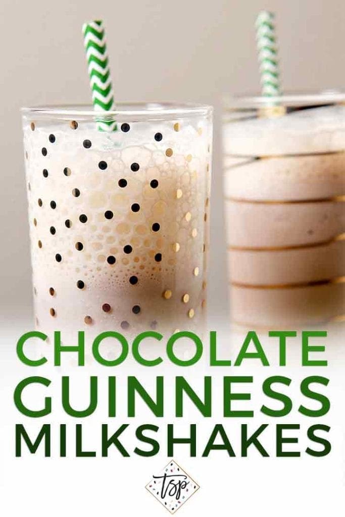 Close up of two glasses holding milkshakes with green straws and the text 'chocolate guinness milkshakes'