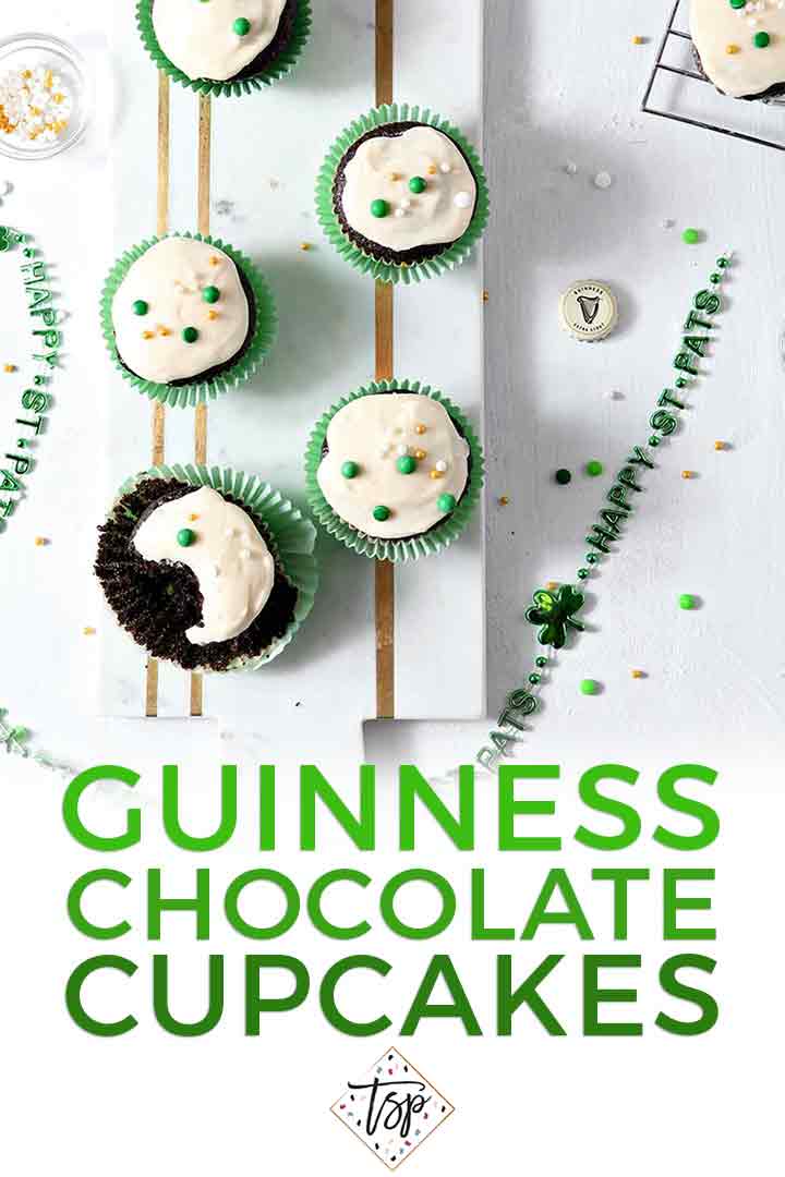 Overhead image of several decorated Irish Car Bomb Cupcakes with Baileys Frosting and Pinterest text