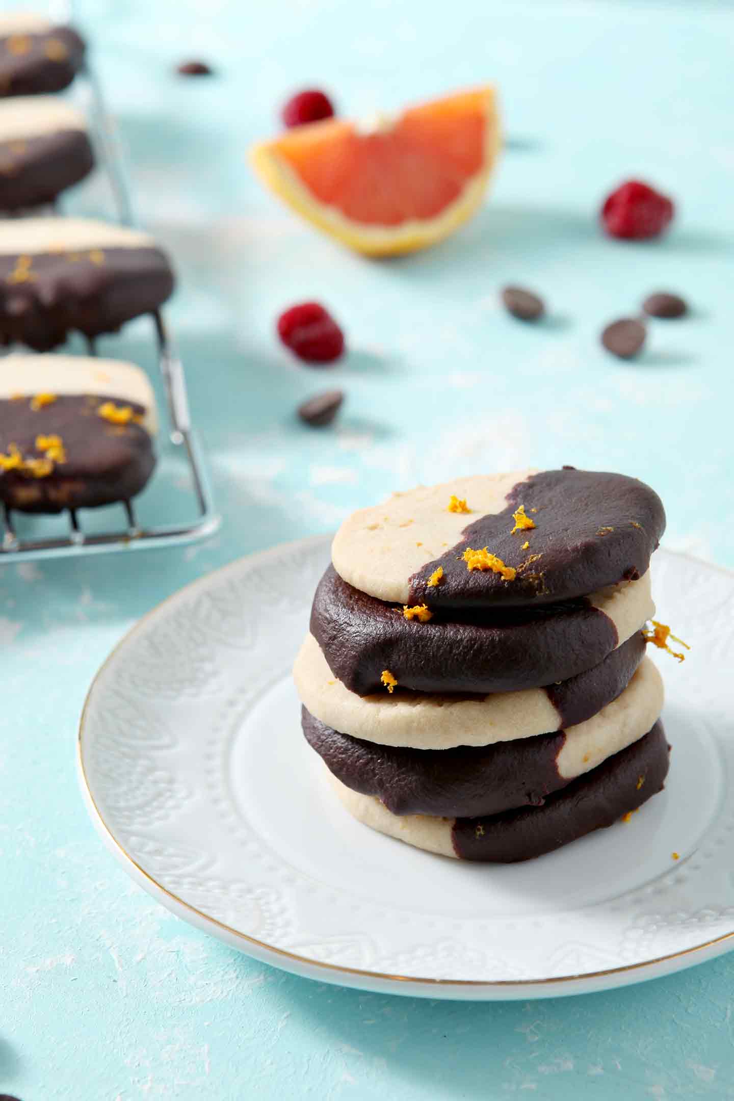 Raspberry Shortbread Cookies stacked on a white plate