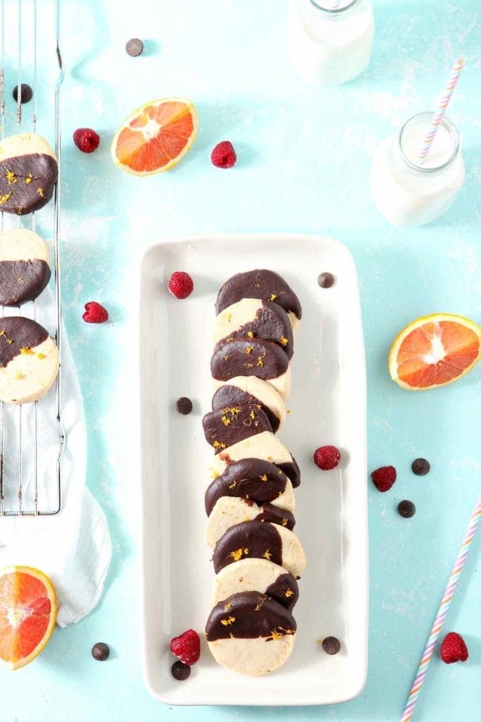 Overhead shot of several Orange Raspberry Shortbread Cookies lined up on a platter