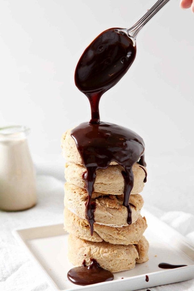 A stack of biscuits is drizzled with a chocolate gravy recipe