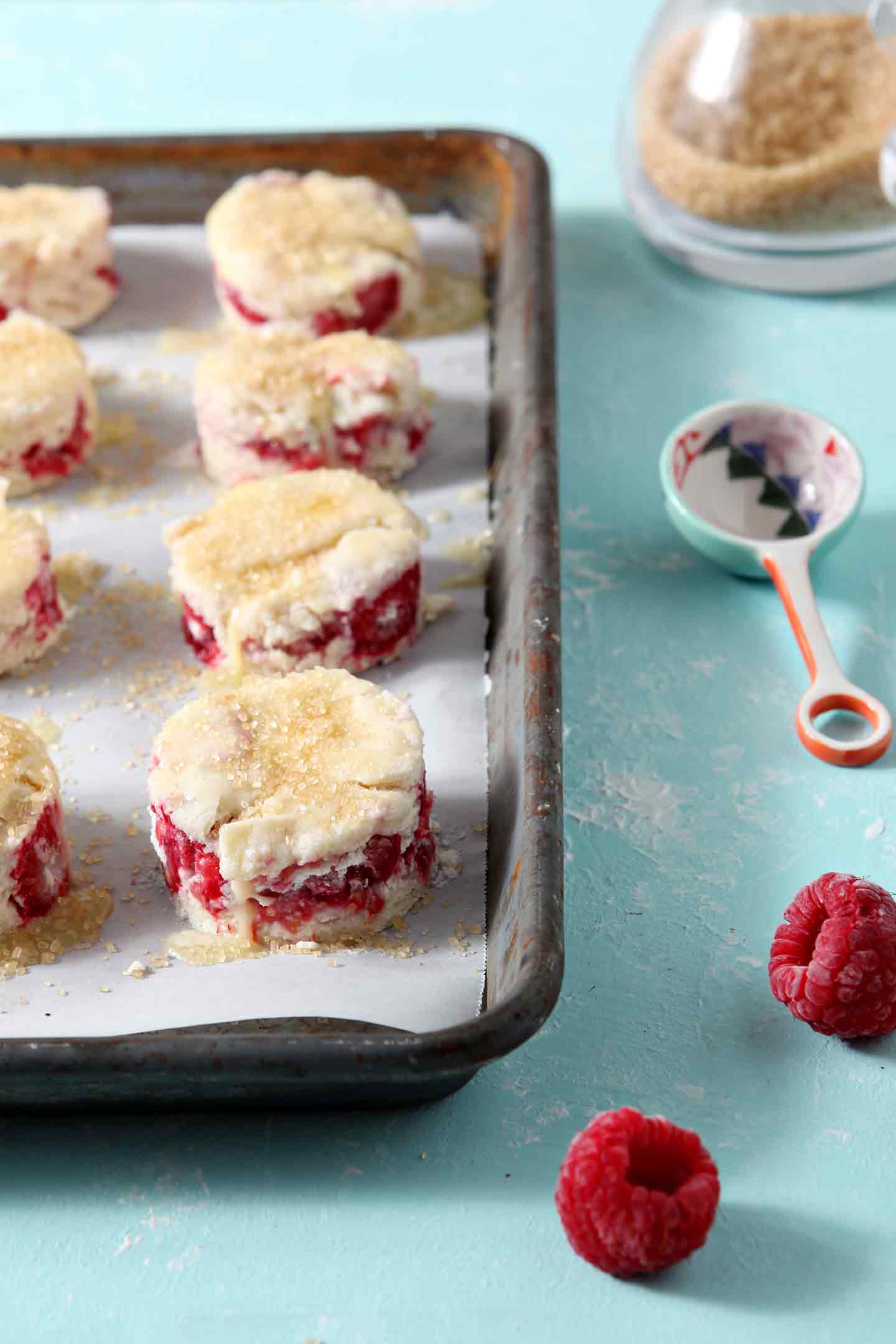 raspberry shortcake biscuits on a baking sheet before going in the oven