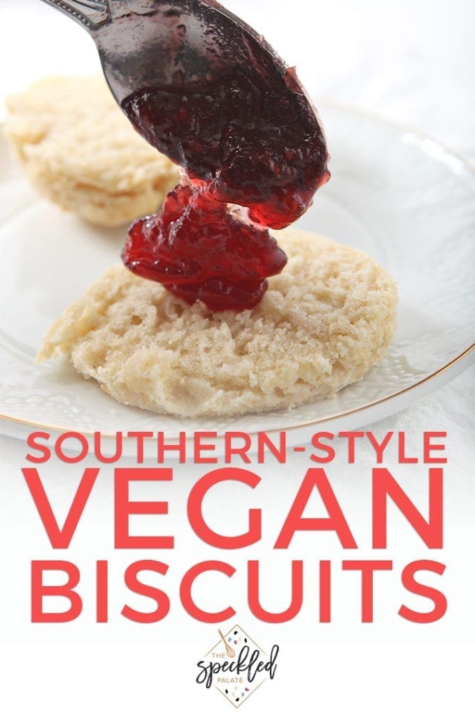 Jelly is dolloped onto a Coconut Oil Southern-Style Biscuit, with Pinterest text