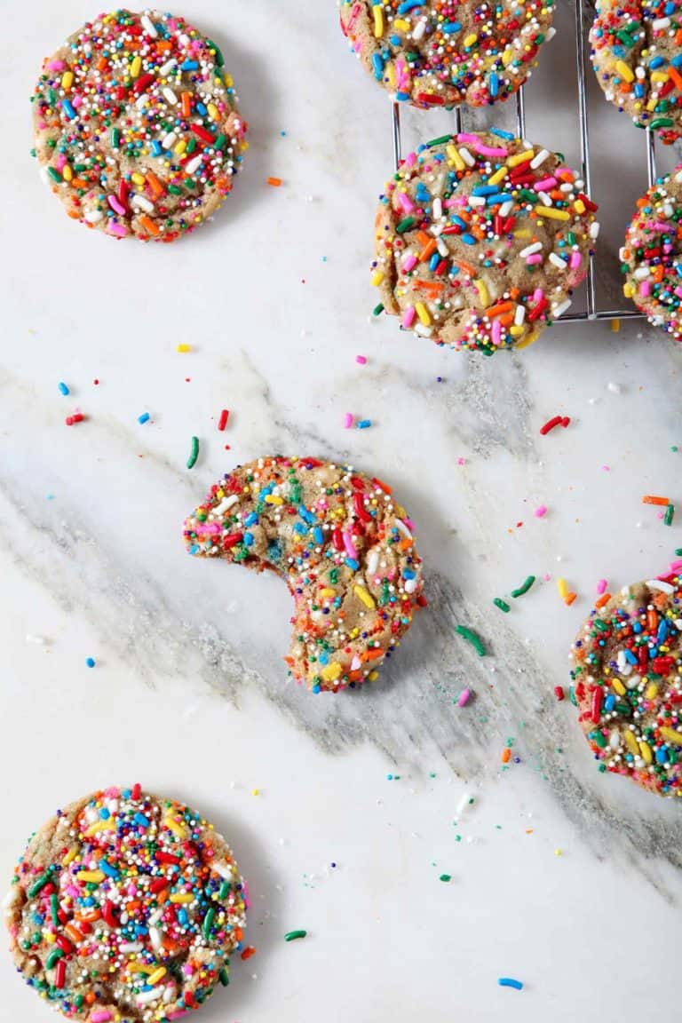 Overhead image of Funfetti Cookies, including one bitten into cookie.