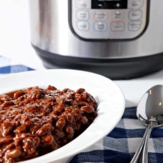 Vegetarian Baked Beans are served in a white bowl in front of an Instant Pot