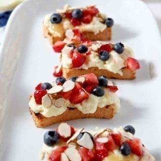 Slices of Strawberry Bruschetta on a white platter