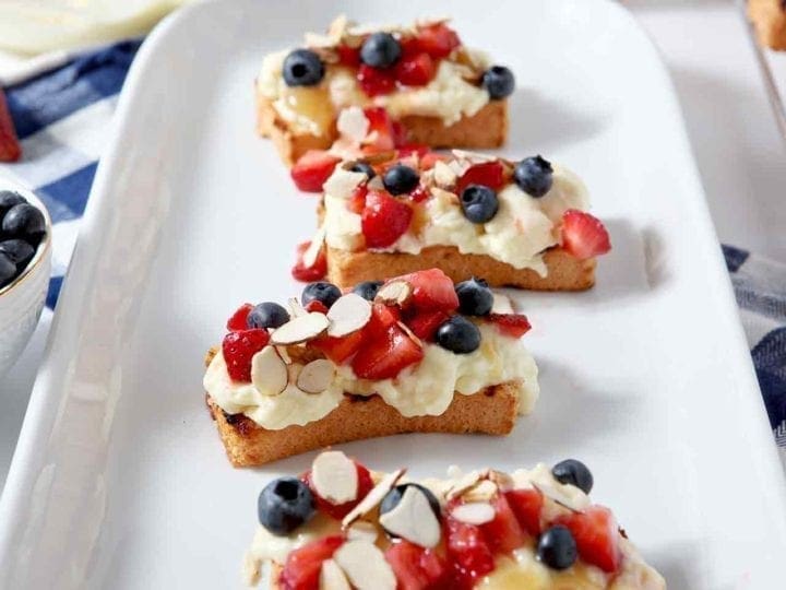 Slices of Strawberry Bruschetta on a white platter
