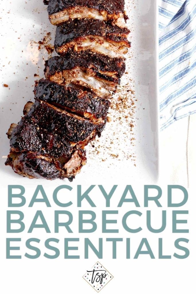 Memphis-Style Barbecue Ribs sit on a white platter, surrounded with Pinterest text.