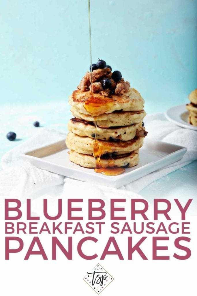 Pinterest graphic for Blueberry Breakfast Sausage Pancakes, featuring a stack of pancakes being topped with maple syrup and text.