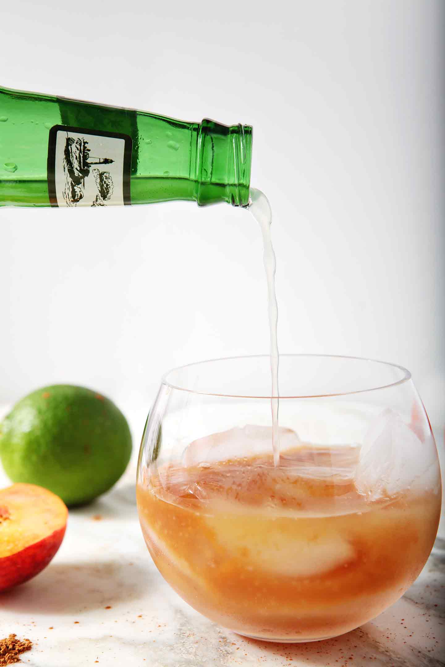 Ginger beer is poured into a glass before it is mixed