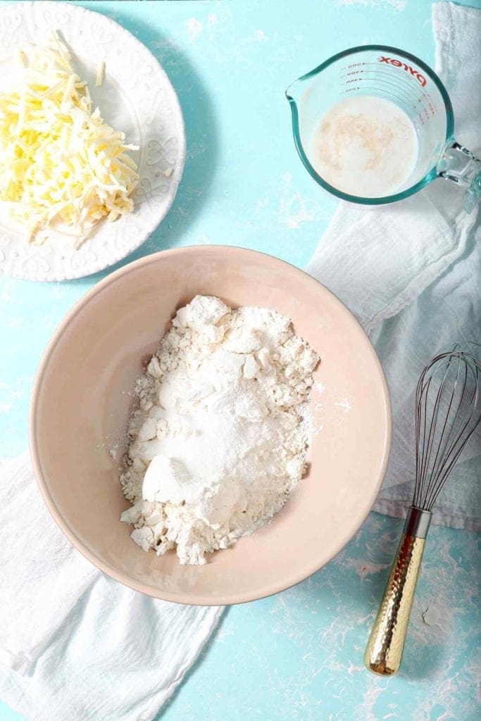 The ingredients for Blackberry Peach Hand Pie Crust are laid out on an aqua background