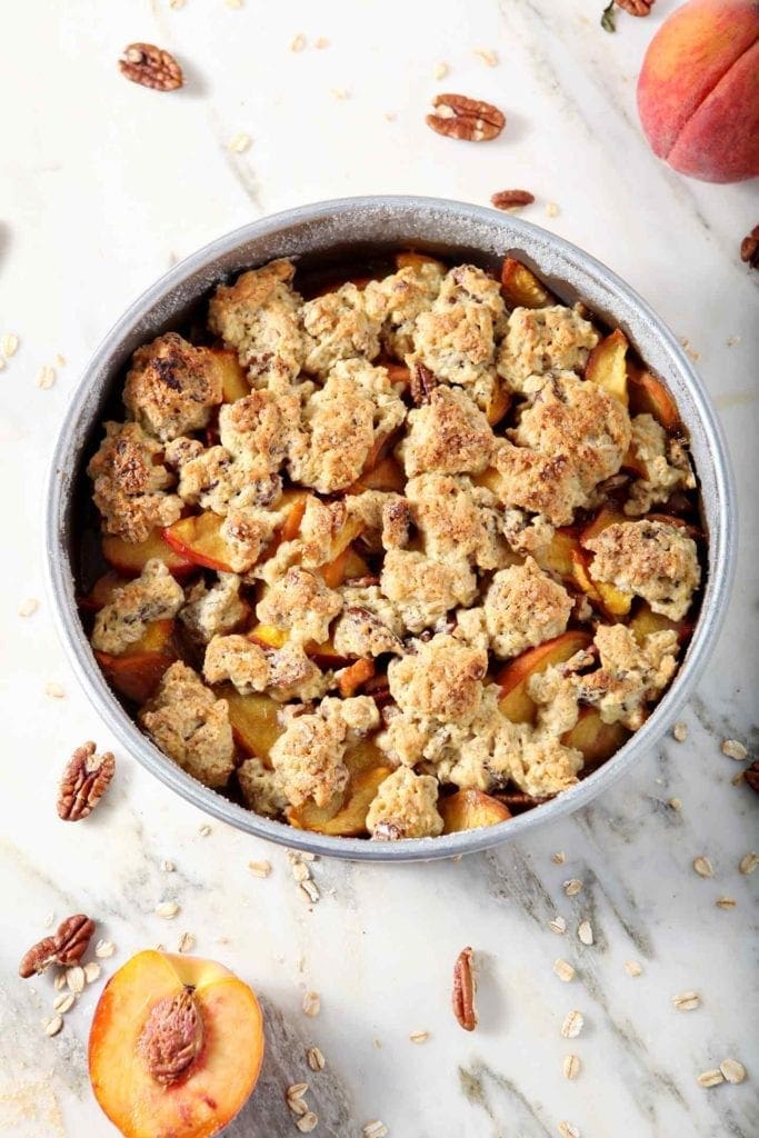 Dairy Free Peach Cobbler is shown from above, straight from the oven