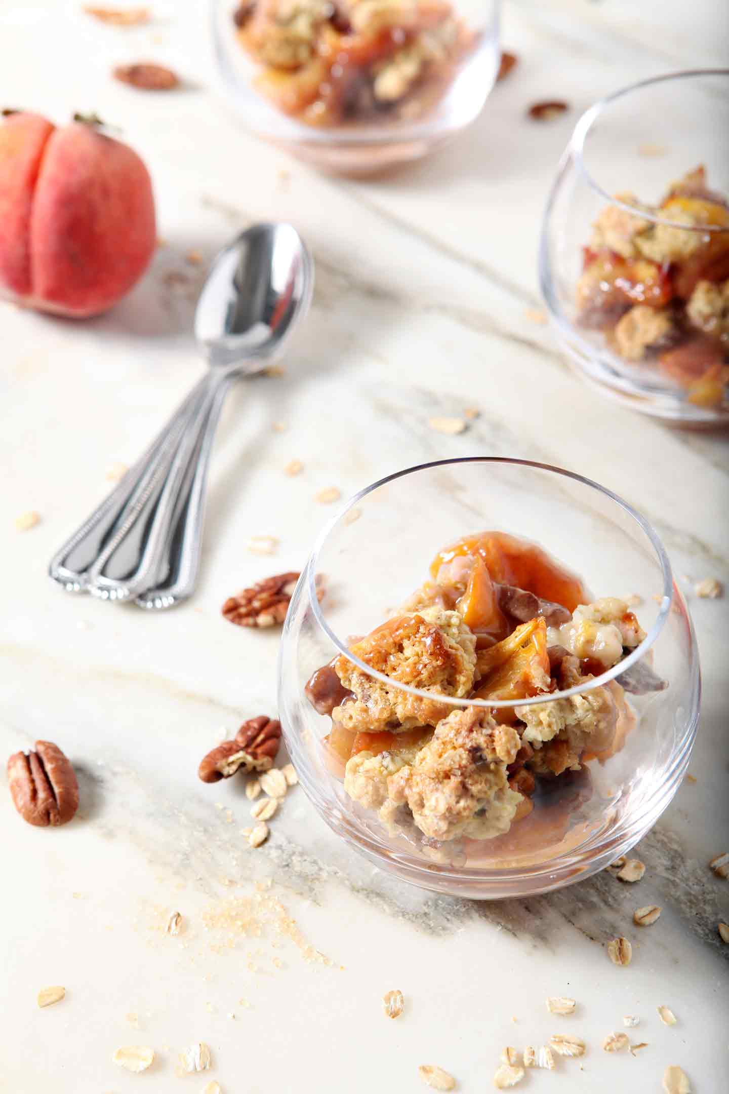 Dairy Free Peach Cobbler is served without dairy free ice cream on a marble counter