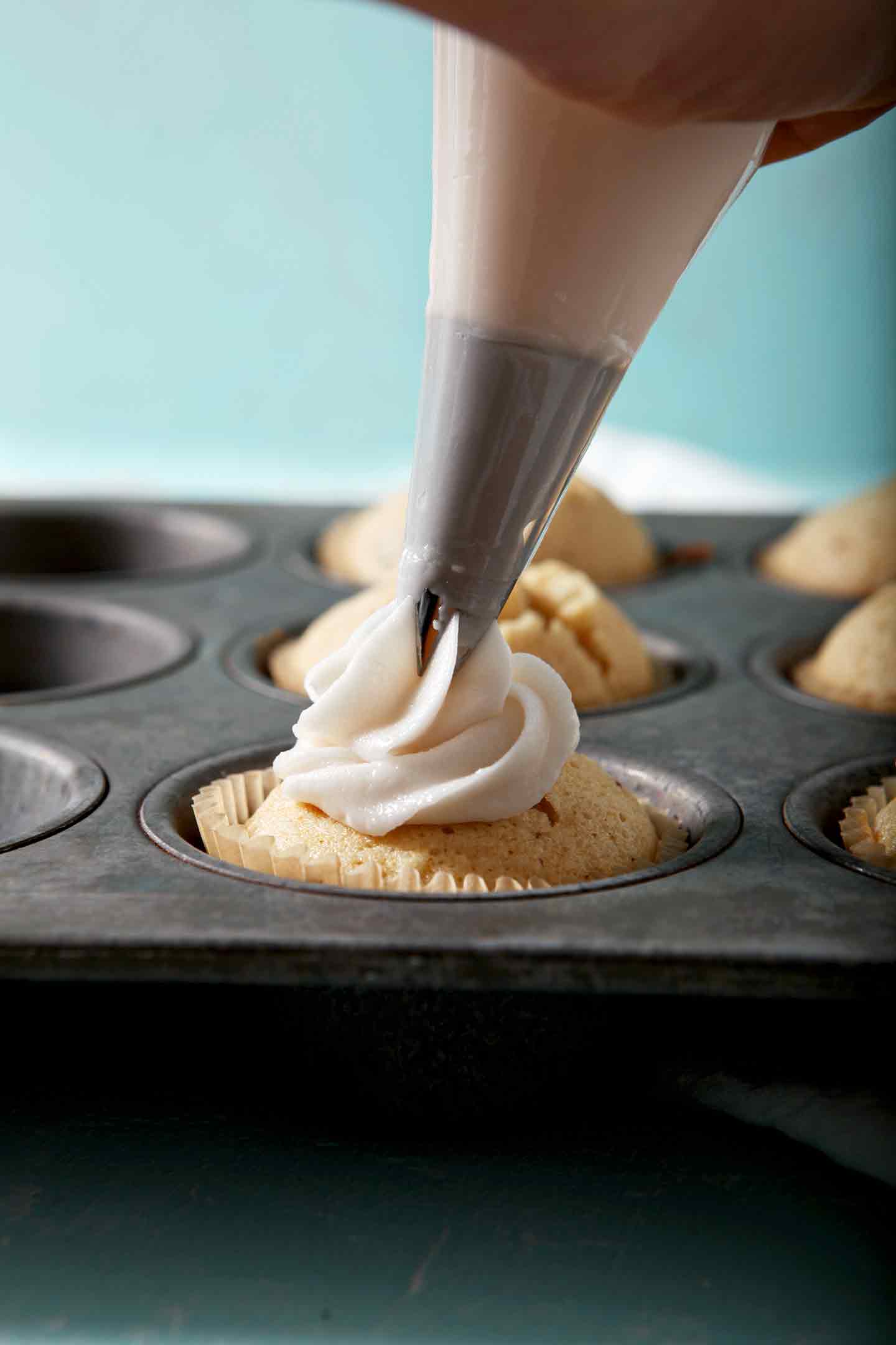 Bourbon Maple Bacon Cupcakes are frosted with Maple Frosting