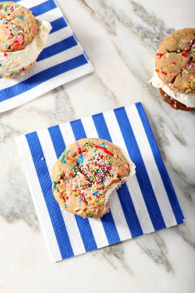 Overhead image of a Funfetti Ice Cream Sandwich, with a bite eaten out of it