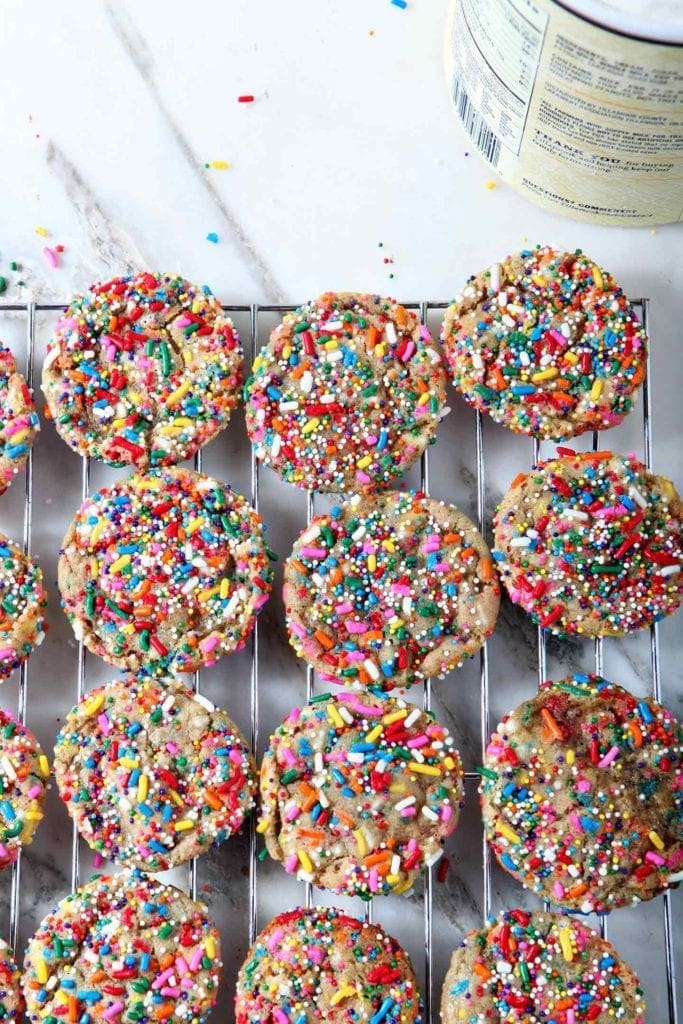 Funfetti Cookies line a wire cooling rack before they are made into Funfetti Ice Cream Sandwiches.