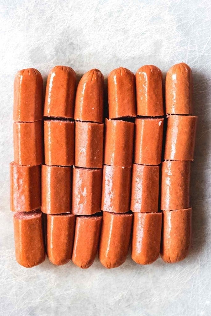 Cut hot dogs are lined up