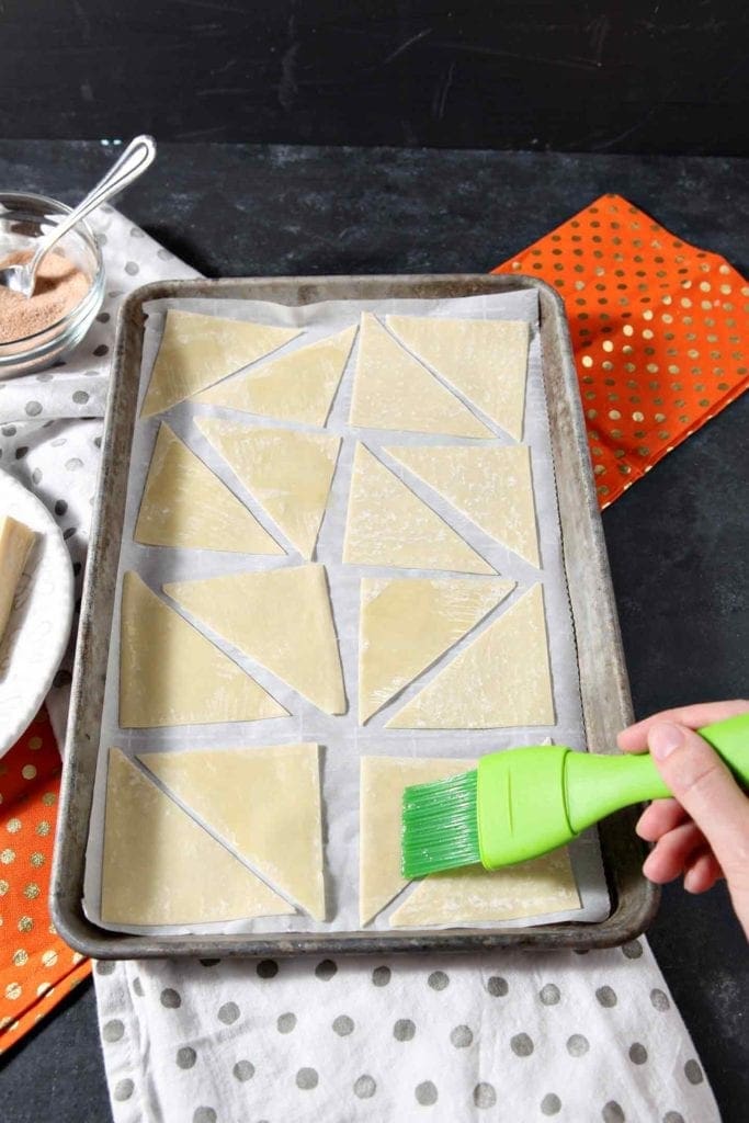 Butter is brushed onto wonton shells to make Cinnamon-Sugar Wonton Chips