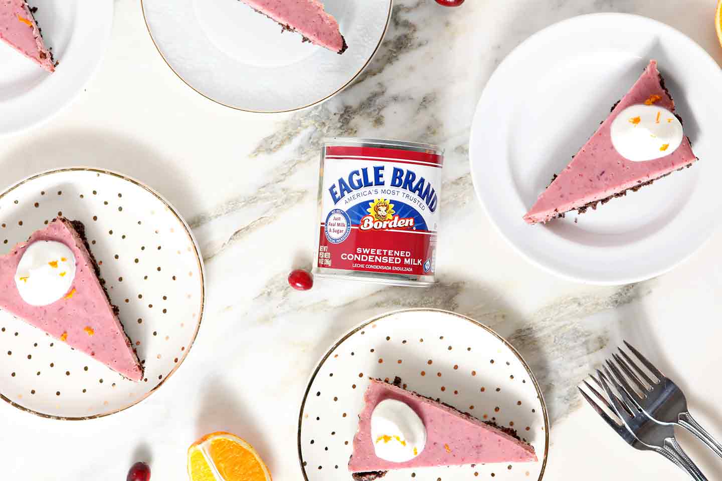 Slices of Creamy Cranberry Tart surround a can of Eagle Brand Sweetened Condensed Milk