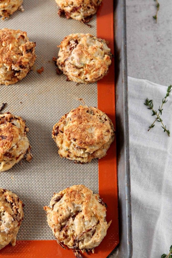 French Onion Biscuits are shown on a baking sheet straight out of the oven