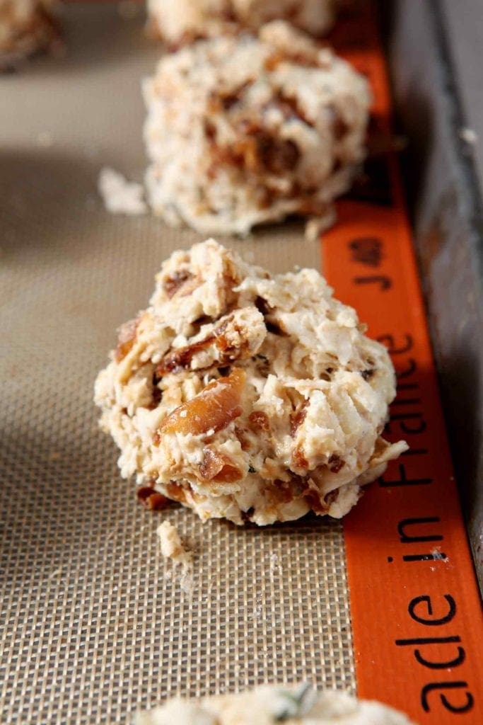 French Onion Biscuits are shown on a baking sheet before baking