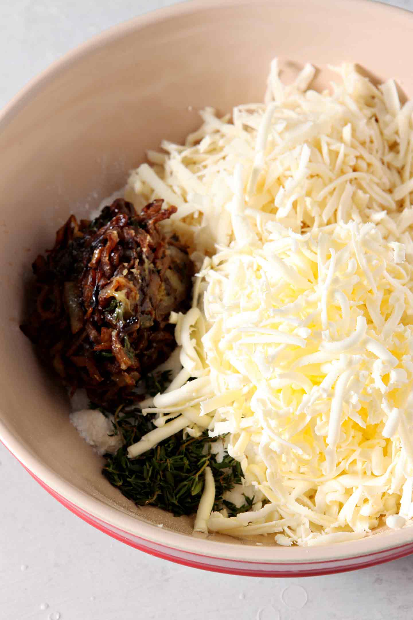 Ingredients for French Onion Biscuits are shown in a bowl