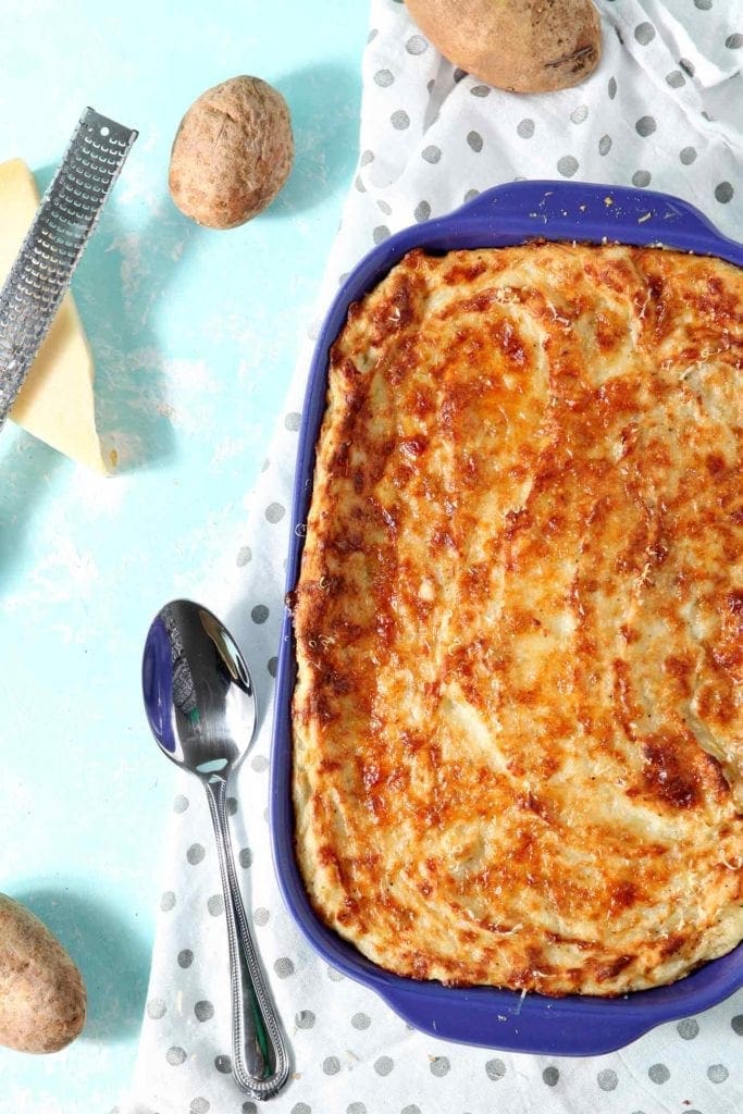 mashed potato casserole in a blue baking dish