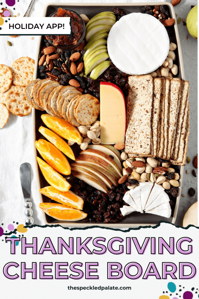 overhead image of a seasonal Cheese Board on a black platter with the text thanksgiving cheese board holiday app