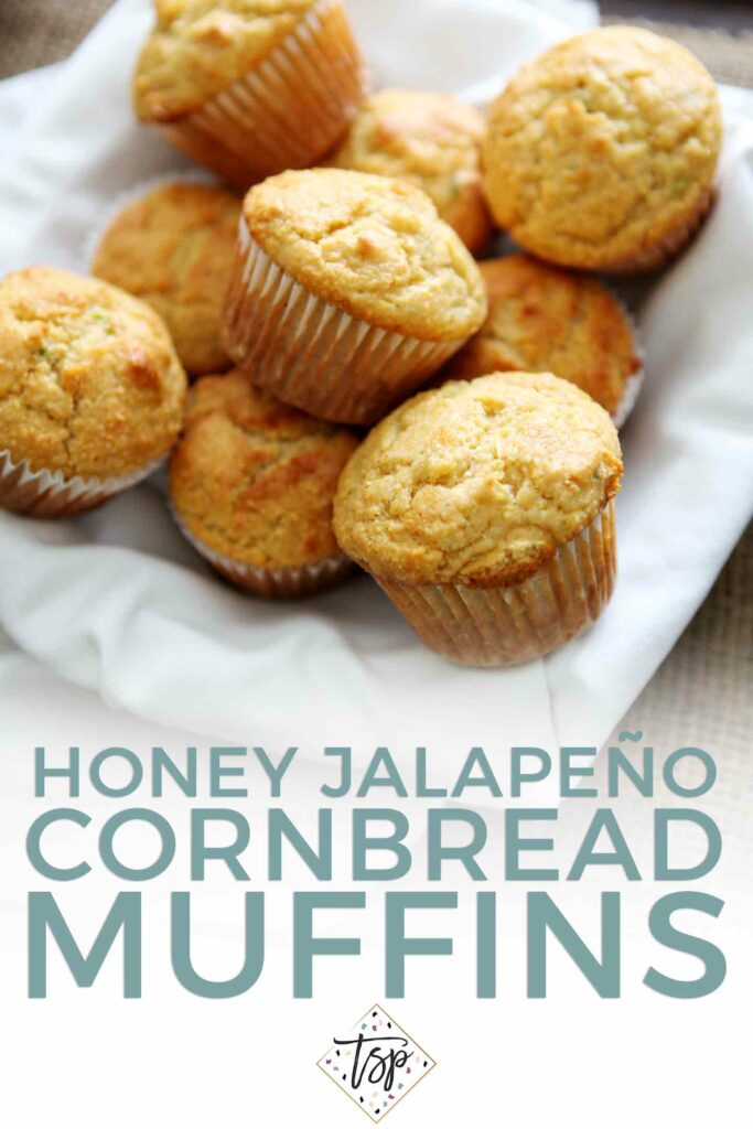 A basket holds several Honey Jalape–no Cornbread Muffins with Pinterest text