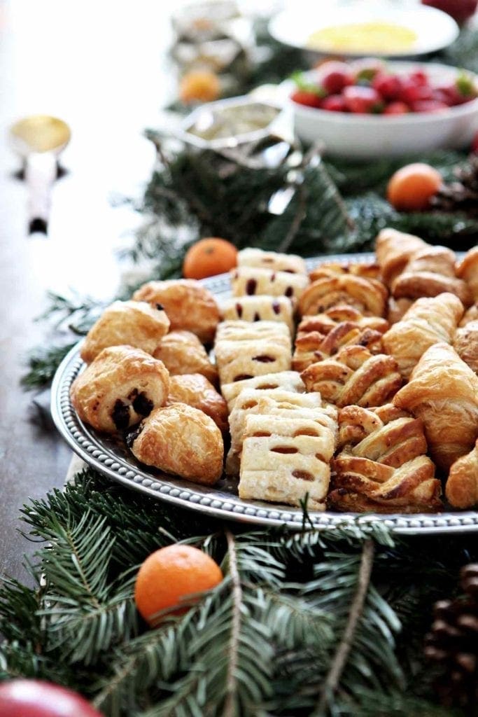 A Holiday Brunch spread is shown, featuring fresh pastries, berries and scrambled eggs