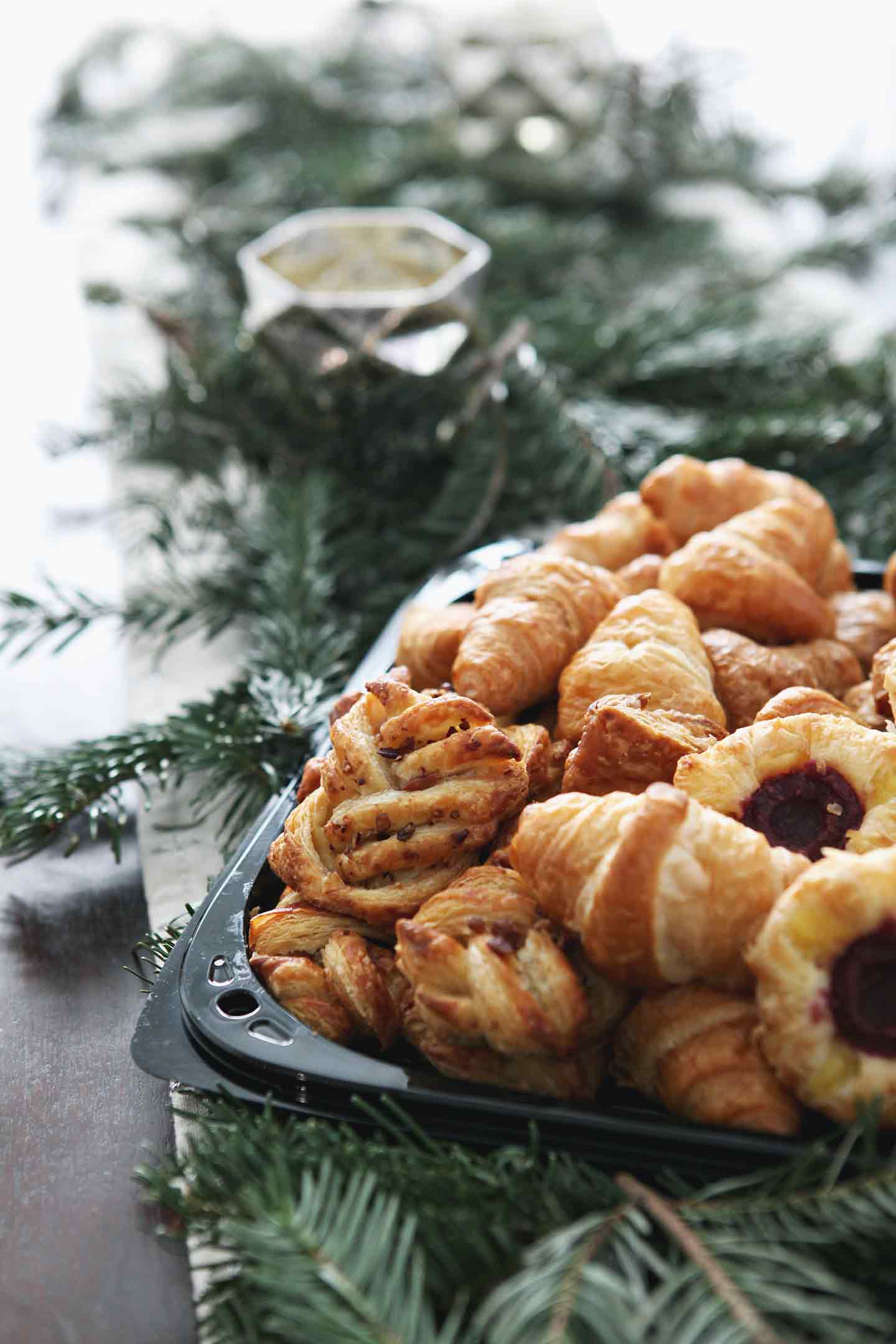 Pastries are shown in their packaging from Sprouts before being moved to a serving platter