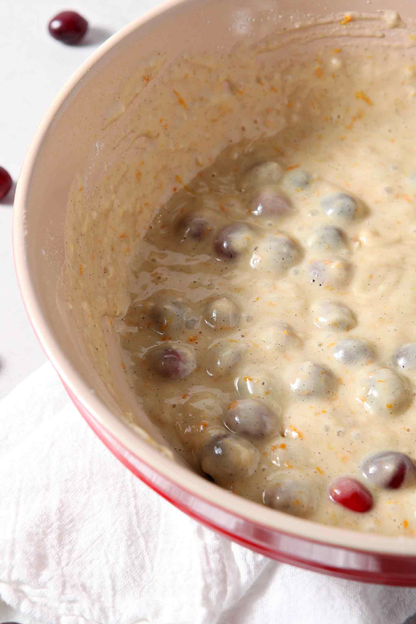 Close up of Vegan Orange Cranberry Muffin batter in a bowl