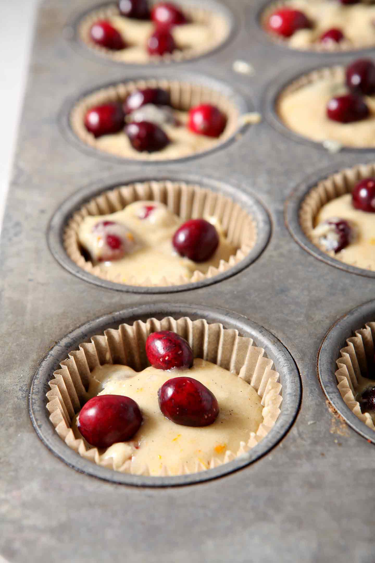 Close up of Vegan Orange Cranberry Muffins in a muffin tin, before baking