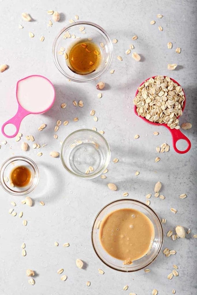 Ingredients for vegan Overnight Oats in bowls on a countertop