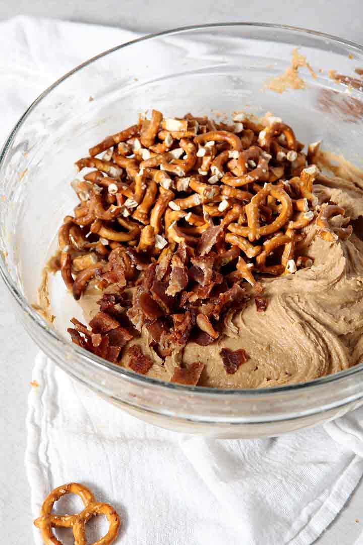 Pretzels and bacon bits are added to the batter for Boozy Bacon Pretzel Peanut Butter Bars