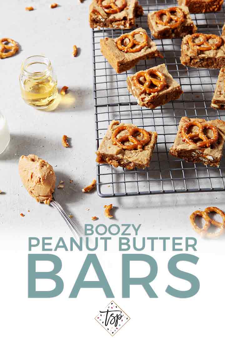 Pinterest graphic for Boozy Bacon Pretzel Peanut Butter Bars, featuring the bars cooling on a wire cooling rack