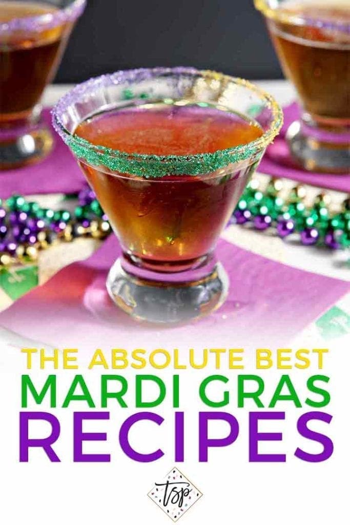 A cocktail is served on a purple napkin, surrounded by beads, for the Mardi Gras Recipes round-up