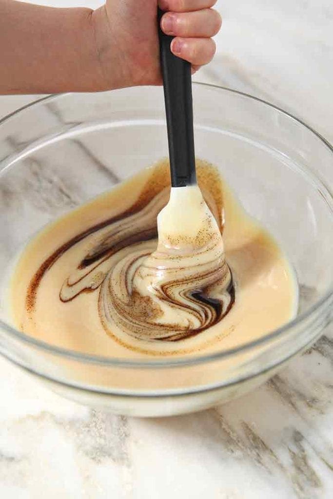 Vanilla bean paste is swirled into the sweetened condensed milk