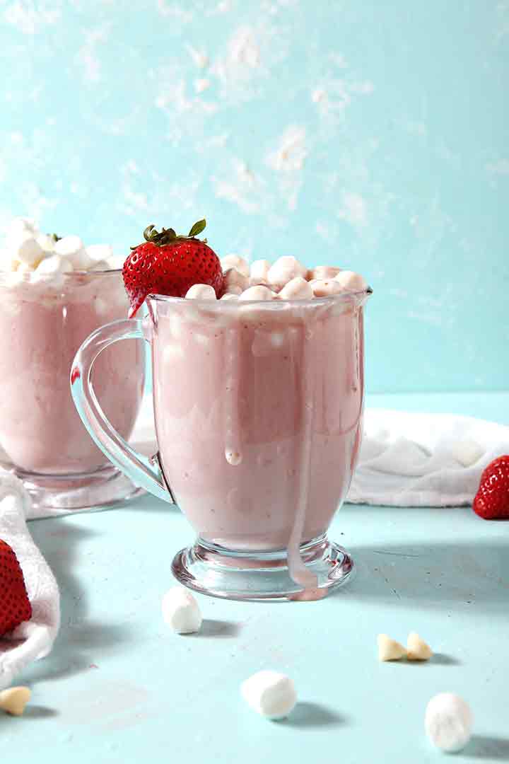 Strawberry White Hot Chocolate drips out of its mug