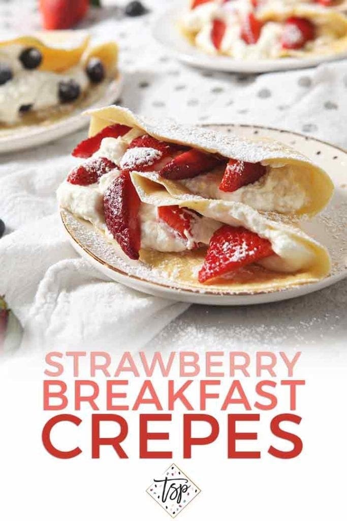 Strawberry Breakfast Crepes are served on a plate with Pinterest text